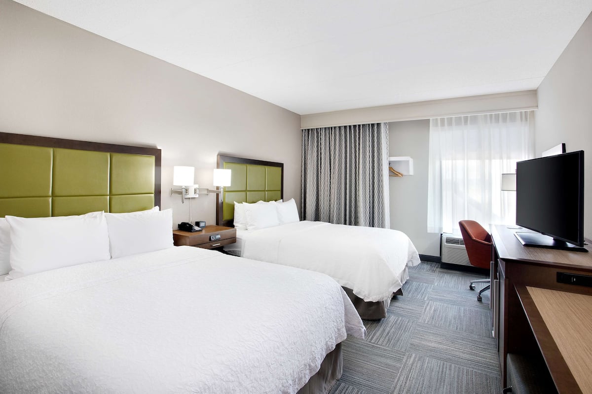 Premium bedding, pillow-top beds, desk, laptop workspace