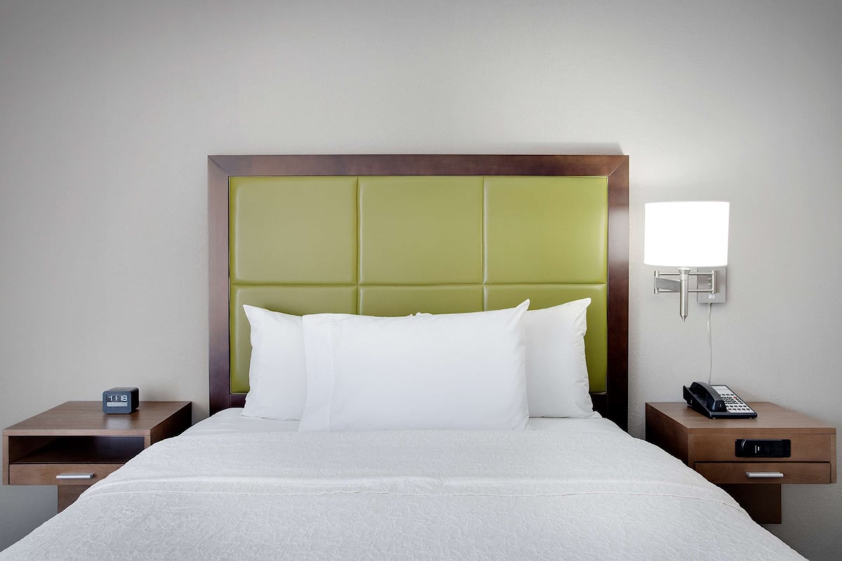 premium bedding, pillow-top beds, desk, laptop workspace