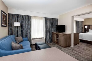Suite, 1 King Bed | Living area | 32-inch LCD TV with cable channels, TV, DVD player