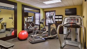 A gym with treadmills, elliptical machines, and a red exercise ball. - Hampton Inn Raleigh/Clayton I-40 (Garner)