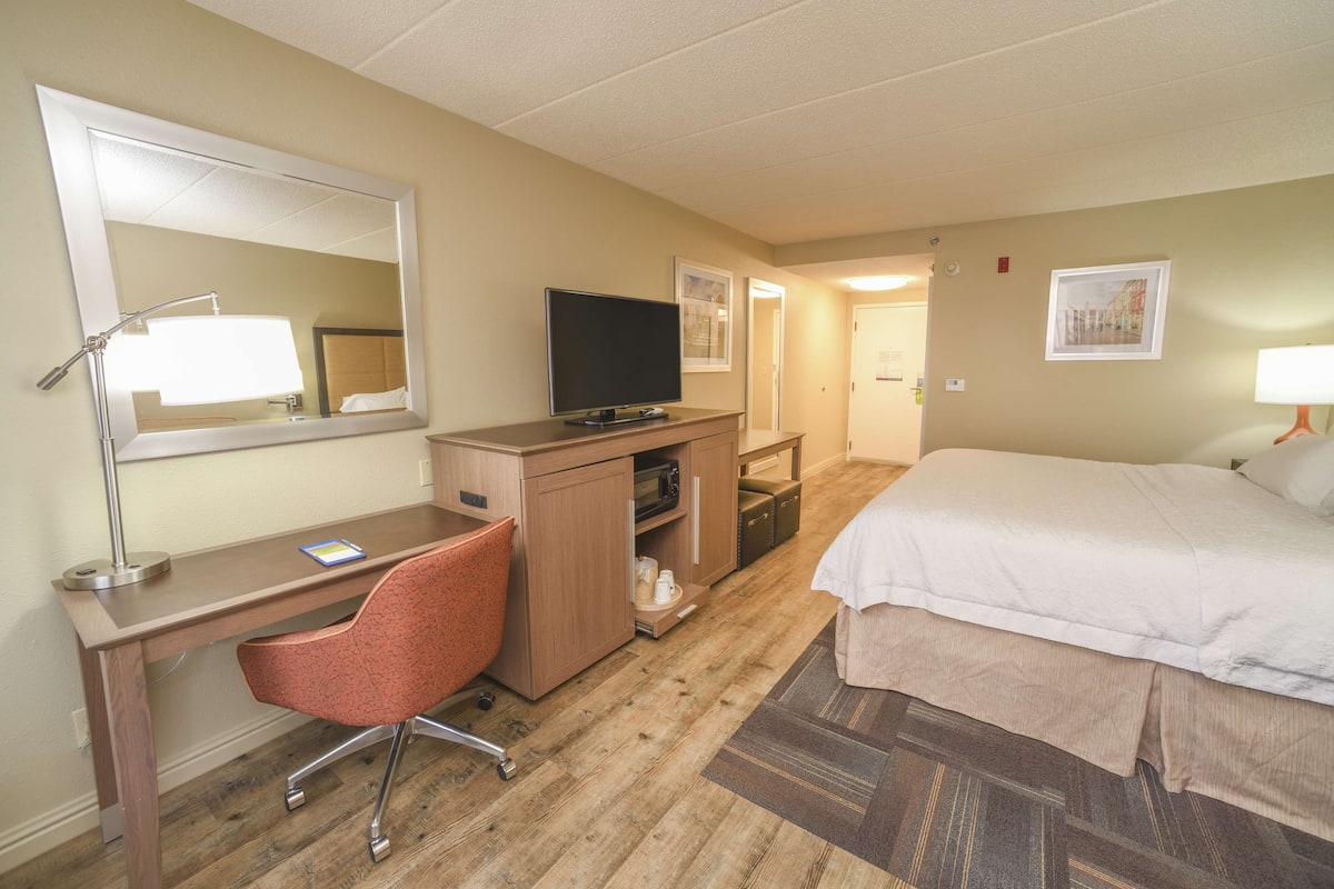 Desk, laptop workspace, blackout curtains, iron/ironing board