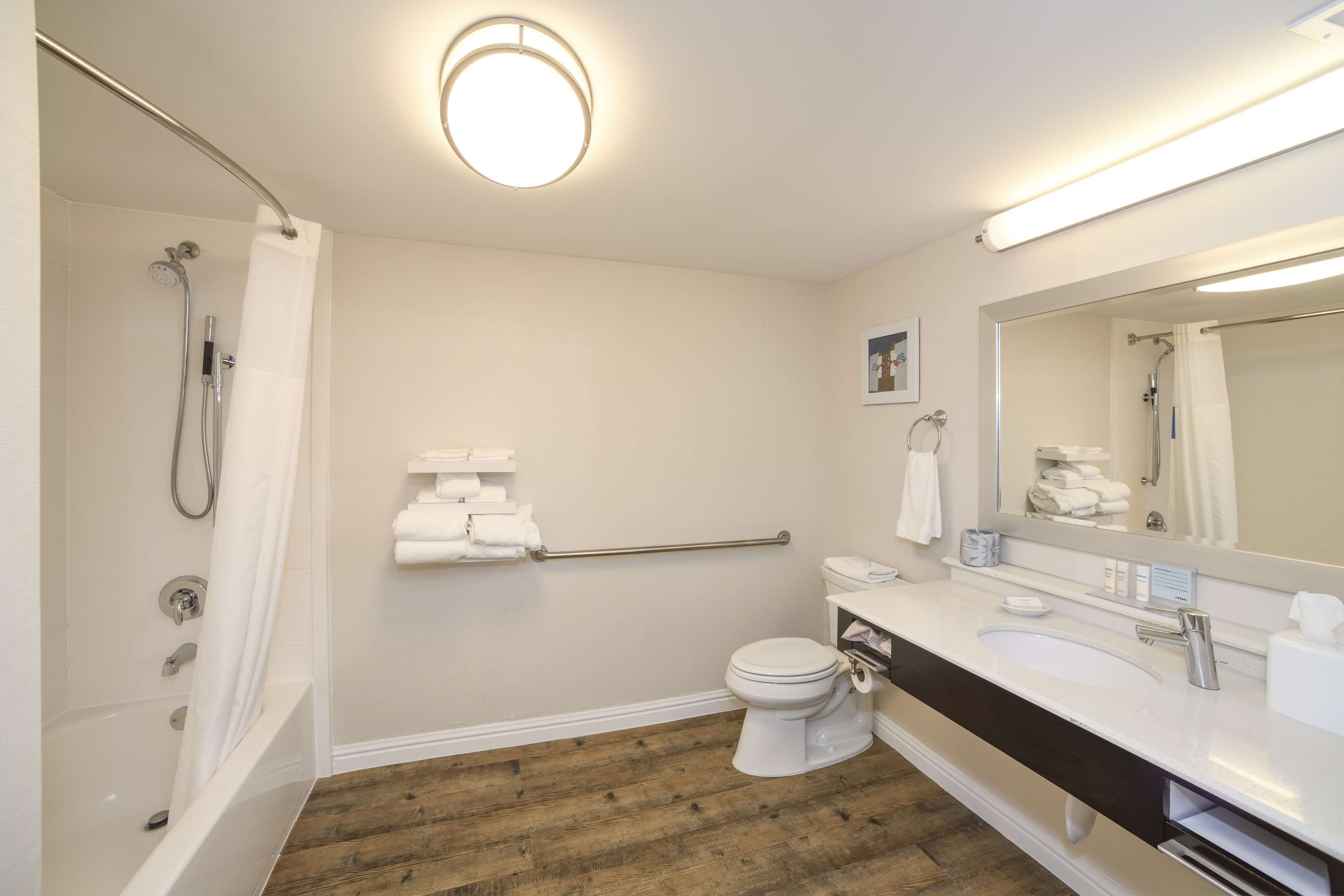 designer toiletries, hair dryer, towels, soap