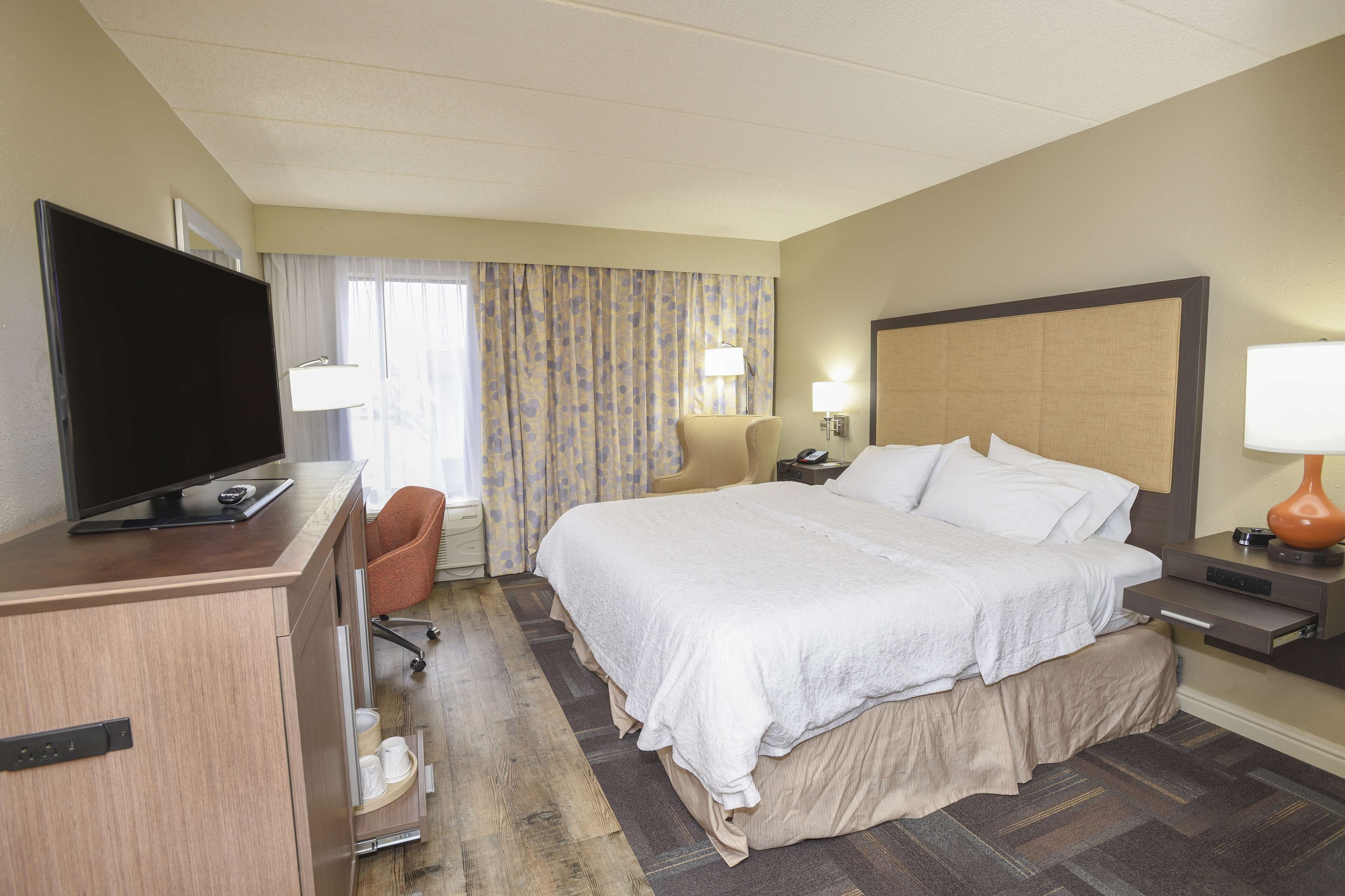 desk, laptop workspace, blackout curtains, iron/ironing board