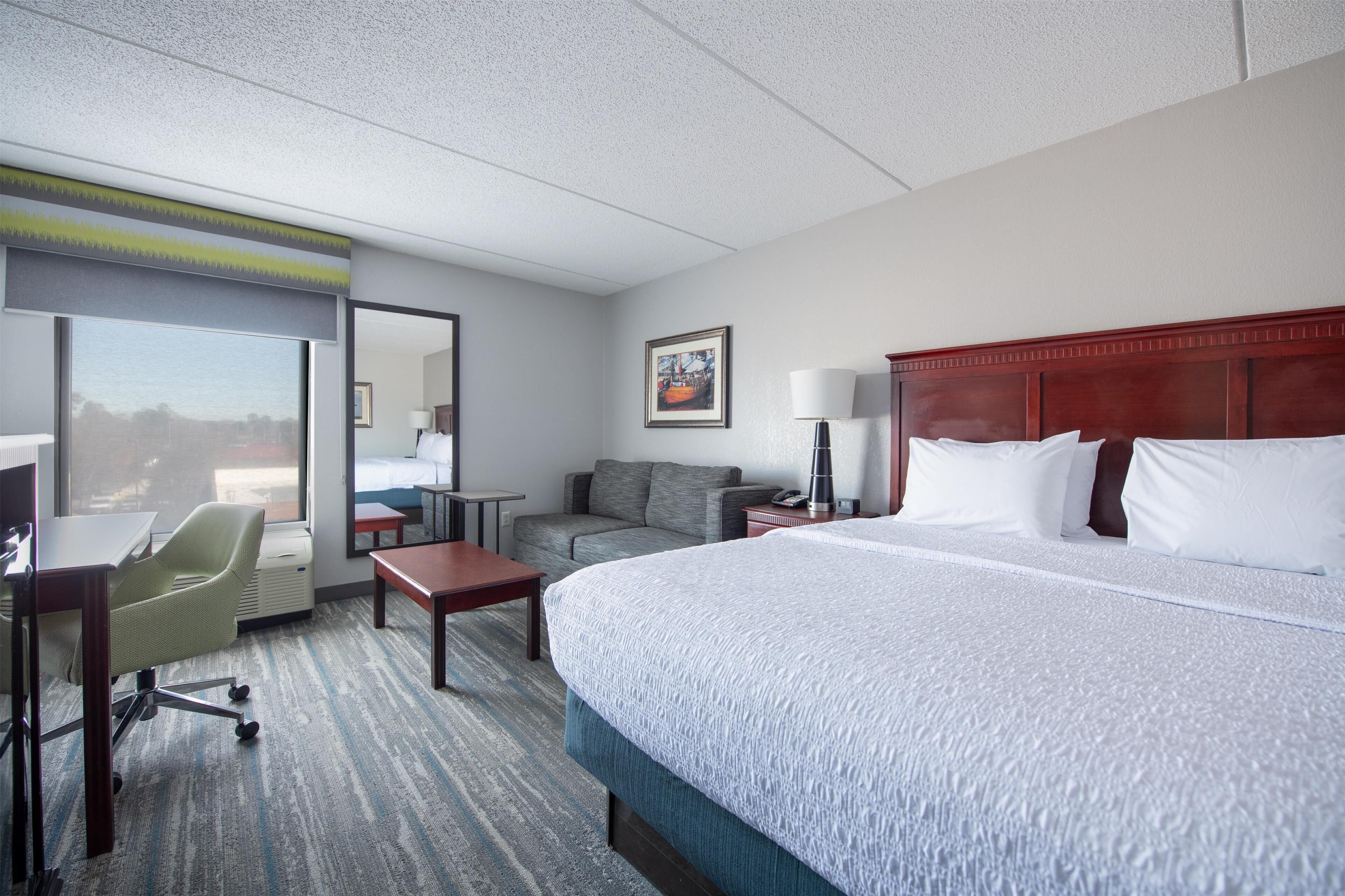 room, 1 king bed with sofa bed, refrigerator & microwave | in-room safe, desk, laptop workspace, blackout curtains