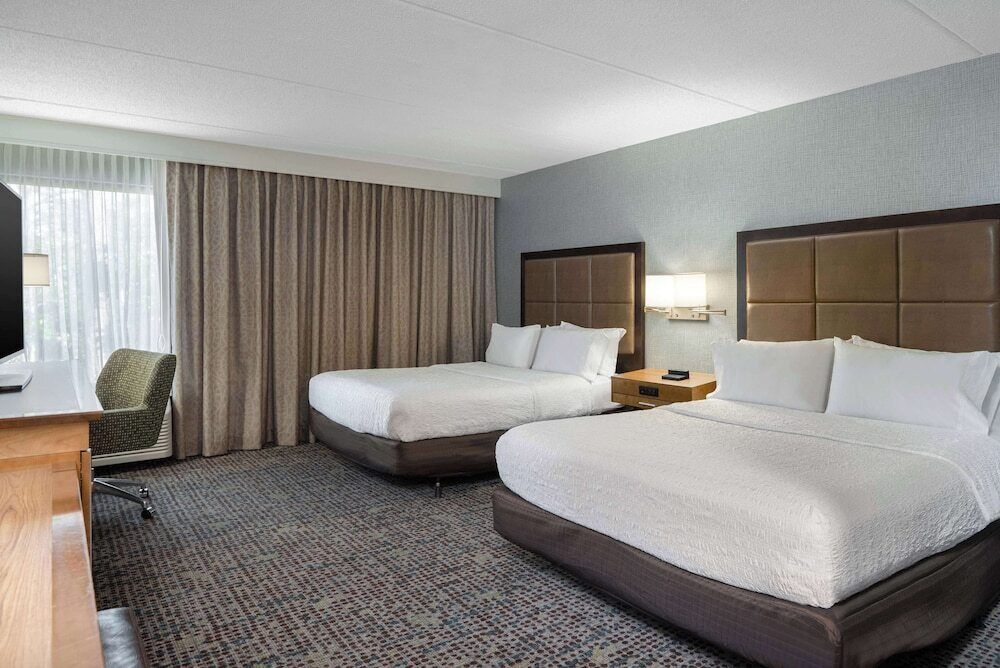 Premium bedding, blackout curtains, iron/ironing board