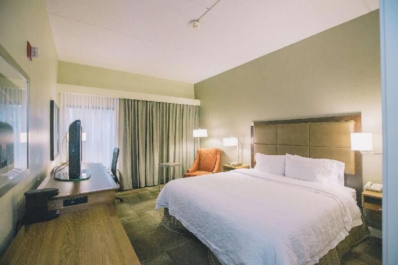 Premium bedding, blackout curtains, iron/ironing board