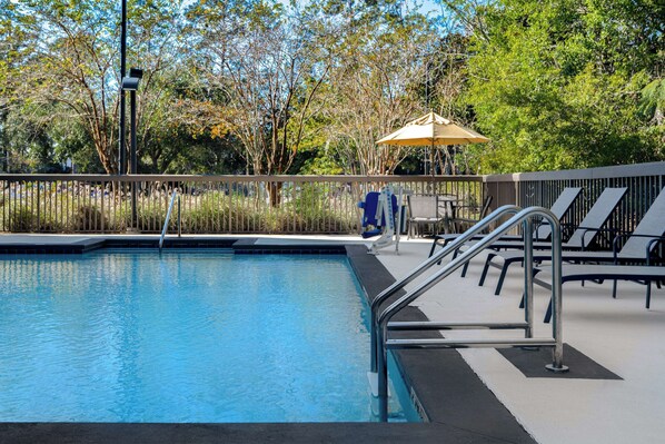 Outdoor pool, open 9 AM to 9 PM, pool umbrellas
