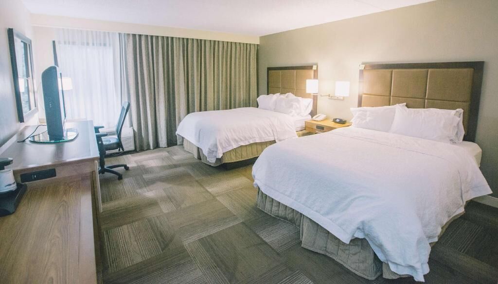 Premium bedding, blackout curtains, iron/ironing board
