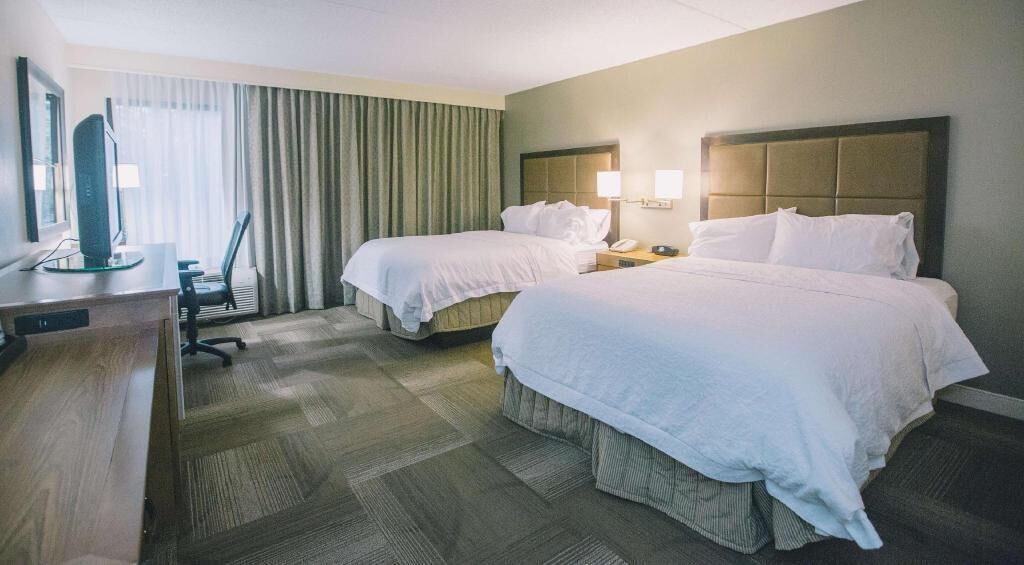 Premium bedding, blackout curtains, iron/ironing board