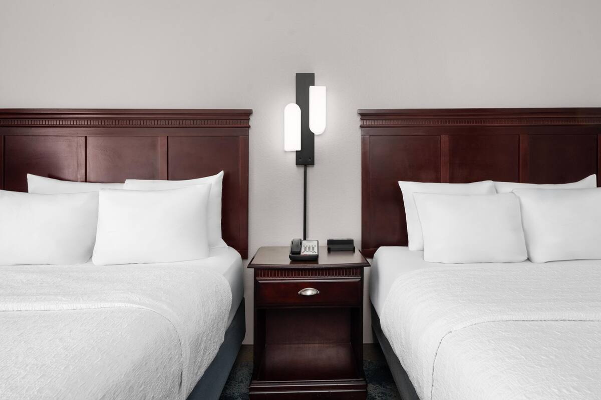 Premium bedding, pillow-top beds, blackout curtains, iron/ironing board