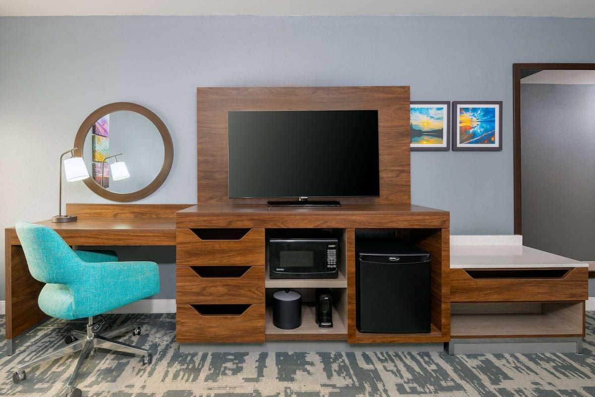 premium bedding, pillow-top beds, blackout curtains, iron/ironing board