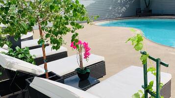 Outdoor pool, open 7:00 AM to 10:00 PM, free cabanas, pool umbrellas