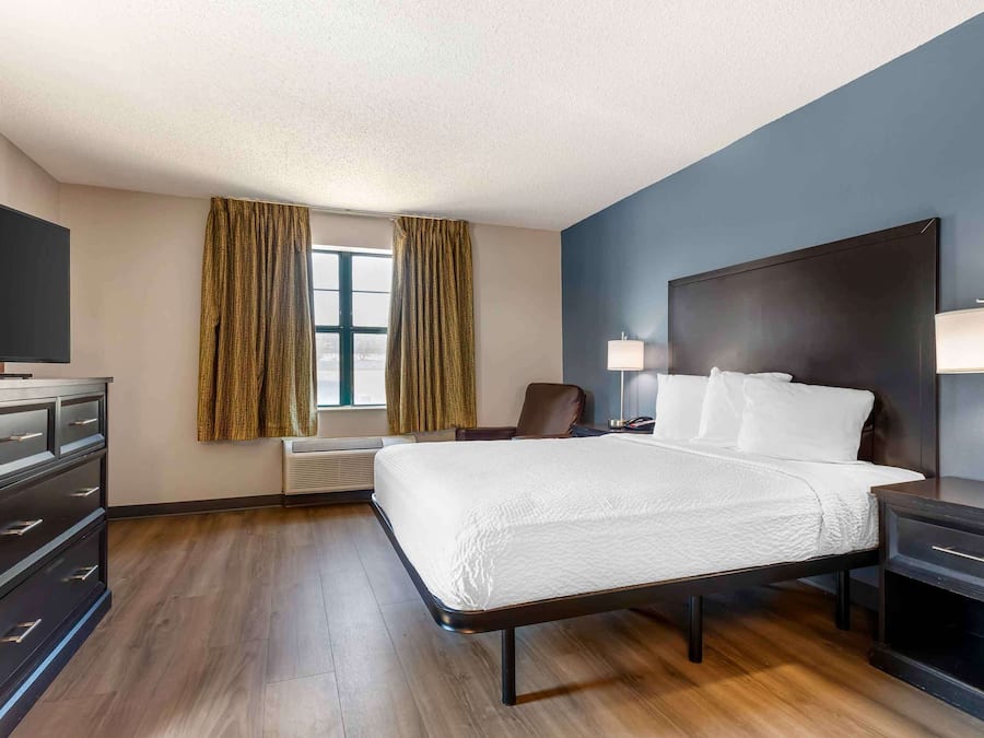 Desk, laptop workspace, blackout curtains, iron/ironing board