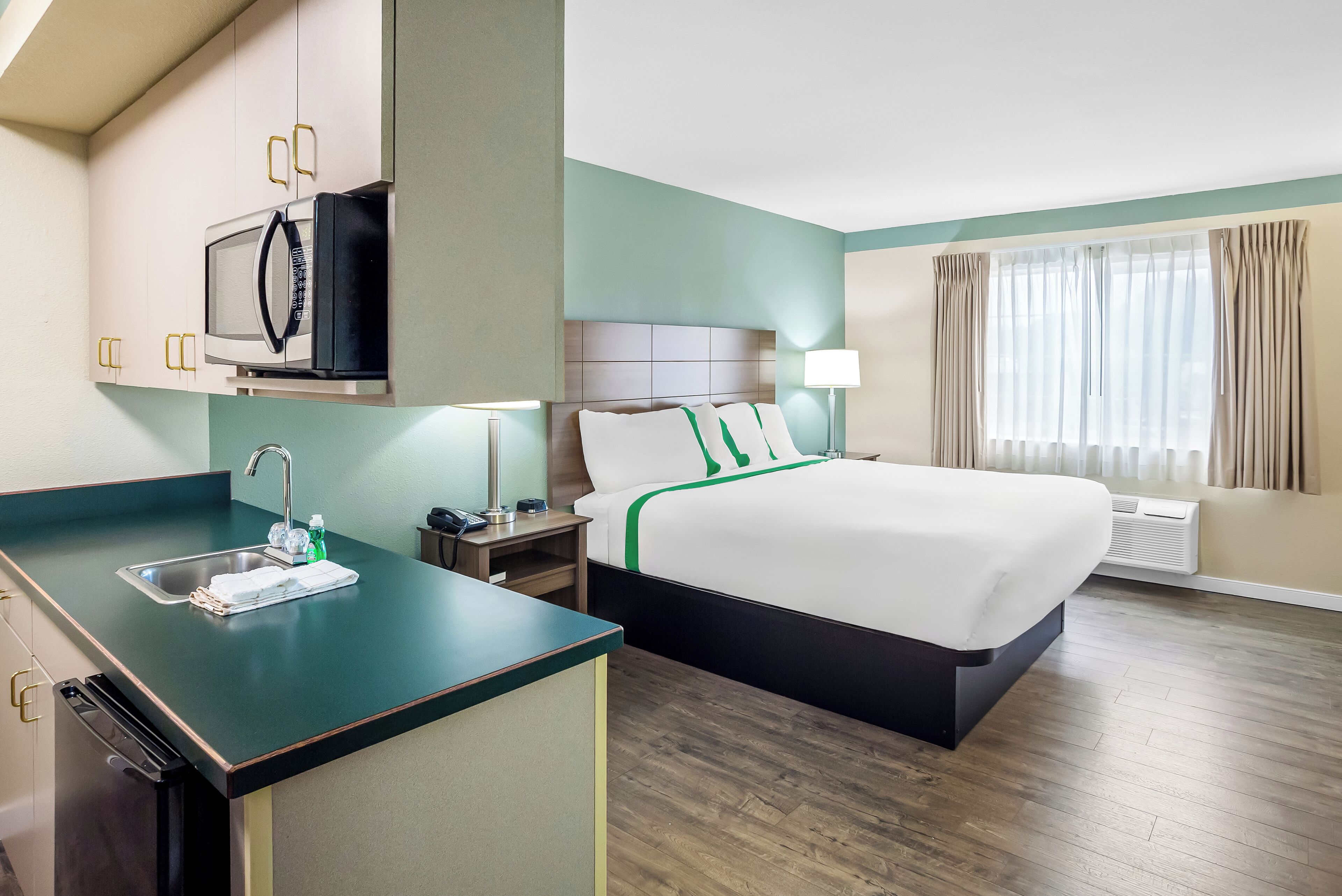 traditional suite, 1 king bed (with wet bar) | desk, blackout curtains, iron/ironing board, free wifi