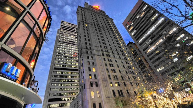A high-rise building with multiple floors and numerous windows, surrounded by other tall buildings. - Magnolia Hotel Dallas Downtown (Dallas)