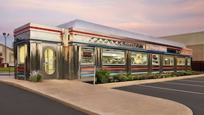 A diner with a retro design, featuring a large awning and a sign that reads "Penn's Diner." - Baymont by Wyndham Hearne (Hearne)