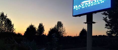 A digital signboard with the text "PAYMONT BY WYNDHAM".