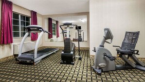 A gym with a treadmill, elliptical, and stationary bike. - Days Inn by Wyndham Norton (Norton)