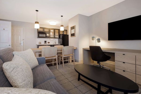 Suite, 1 Queen Bed with Sofa bed (One Bedroom) | Living area | Flat-screen TV