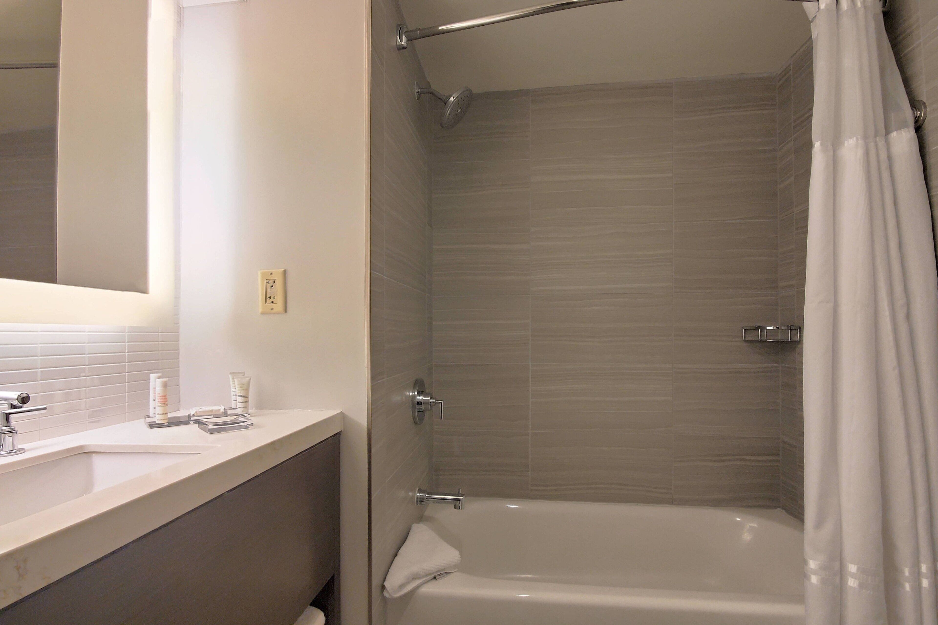 designer toiletries, hair dryer, towels, soap