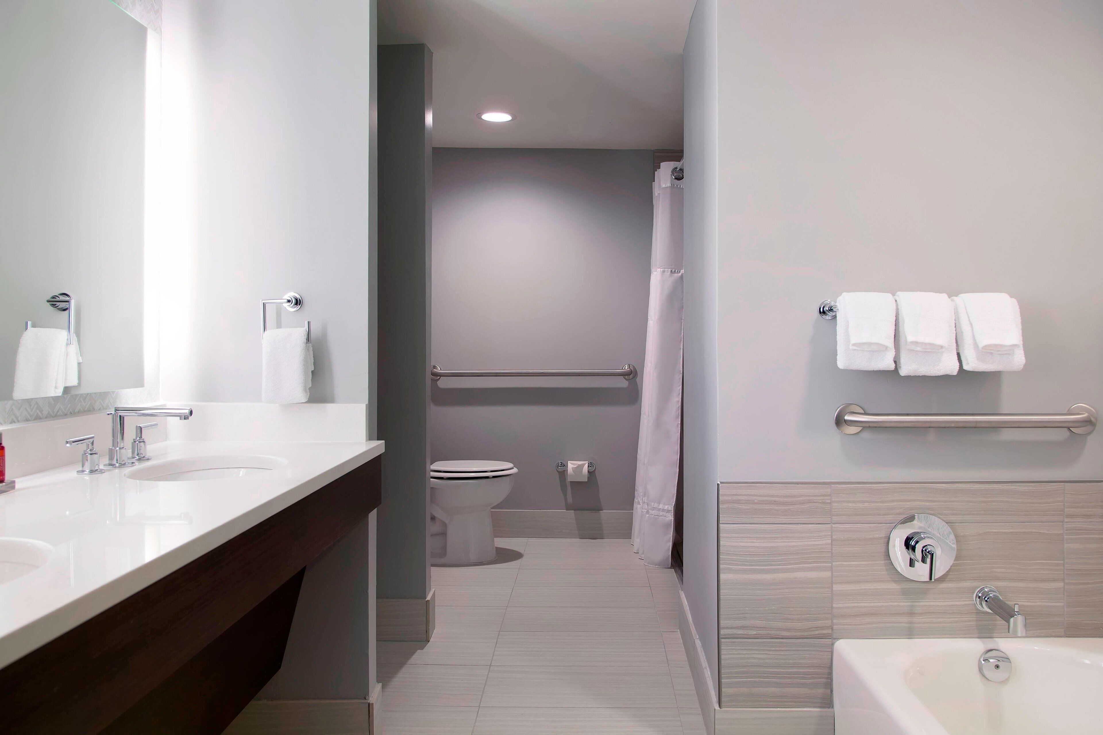 designer toiletries, hair dryer, towels, soap