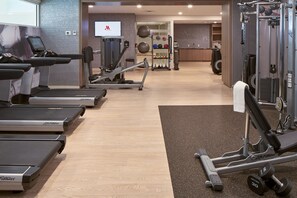 A gym with treadmills, elliptical machines, and weightlifting equipment. - Franklin Marriott Cool Springs (Franklin)