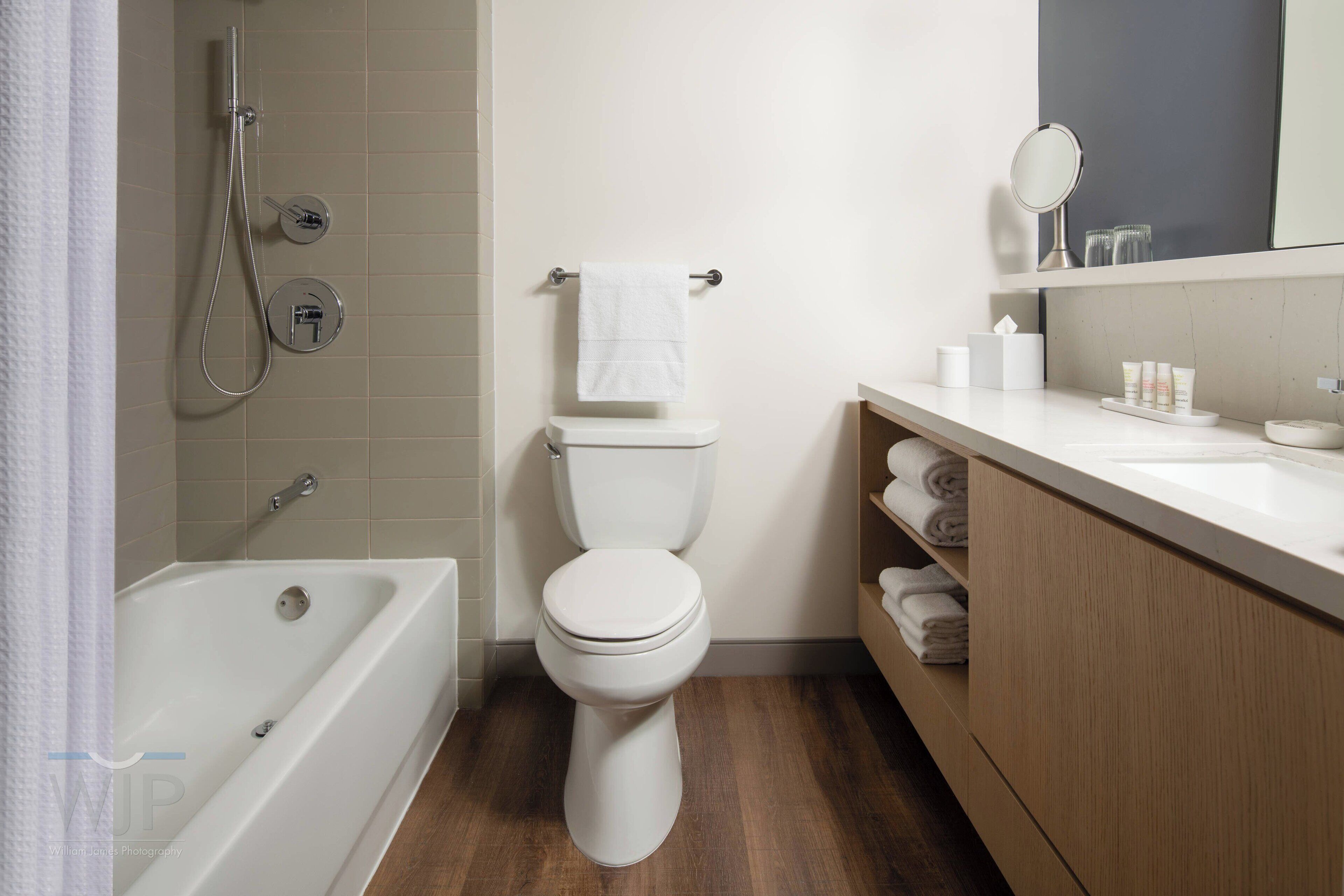 designer toiletries, hair dryer, towels, soap