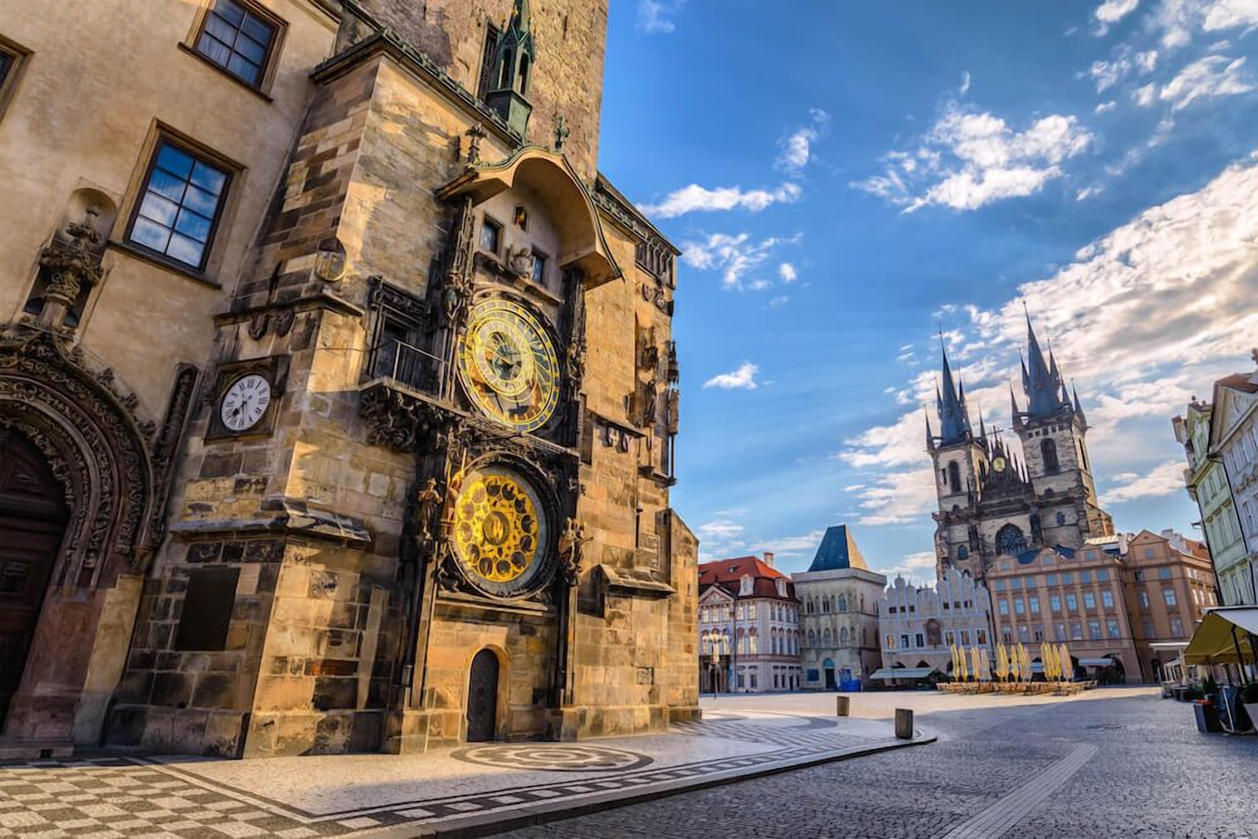 A historic building with ornate architecture, including a large clock tower and a prominent clock face.