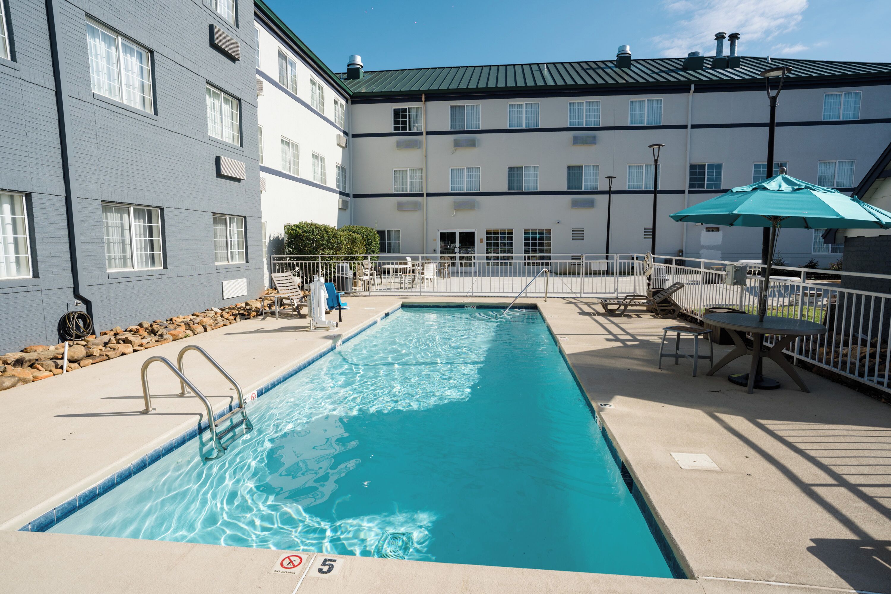 seasonal outdoor pool, open 10 am to 10 pm, pool loungers