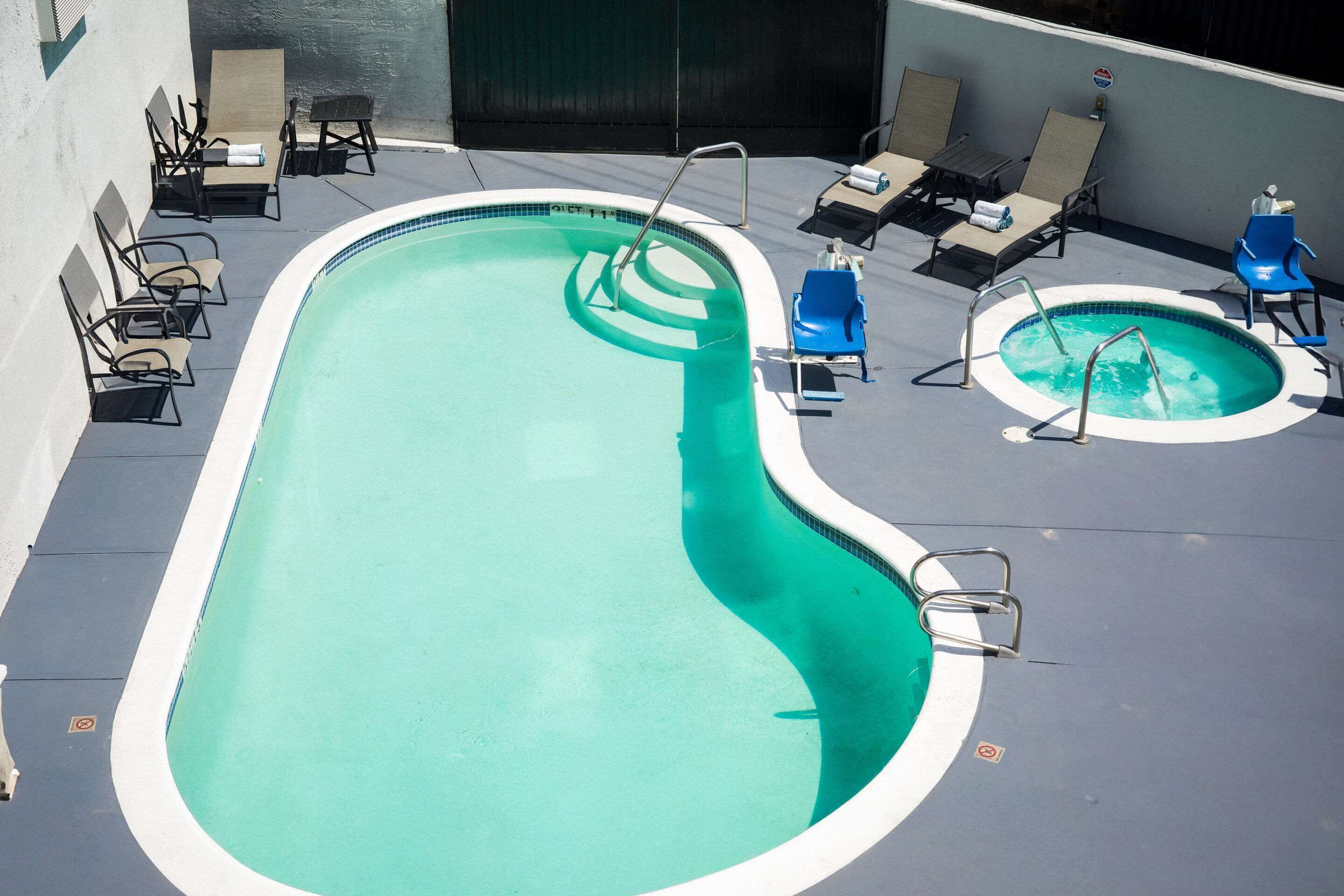 outdoor pool, open 9:00 am to 9:00 pm, pool umbrellas, pool loungers