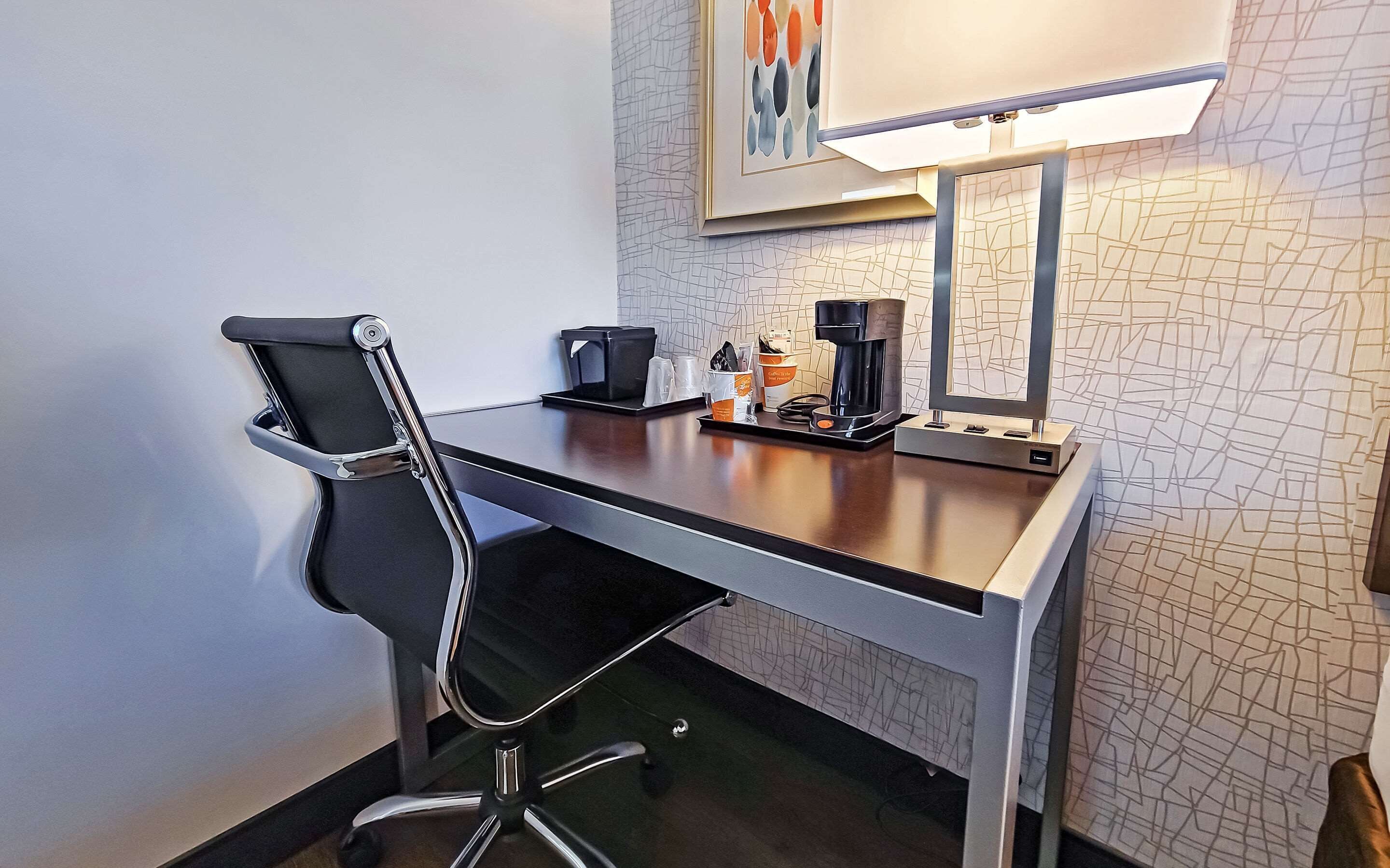 pillow-top beds, desk, laptop workspace, blackout curtains