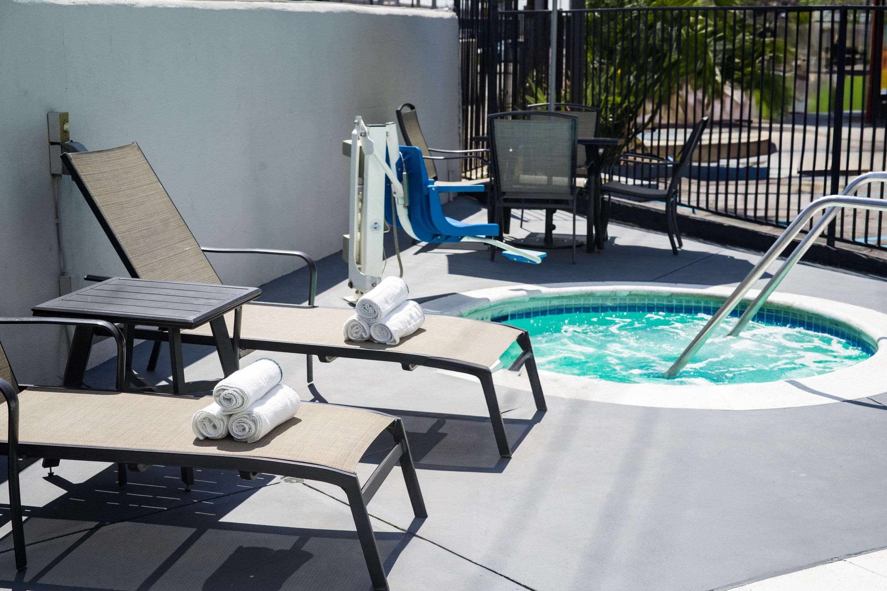 outdoor pool, open 9:00 am to 9:00 pm, pool umbrellas, pool loungers