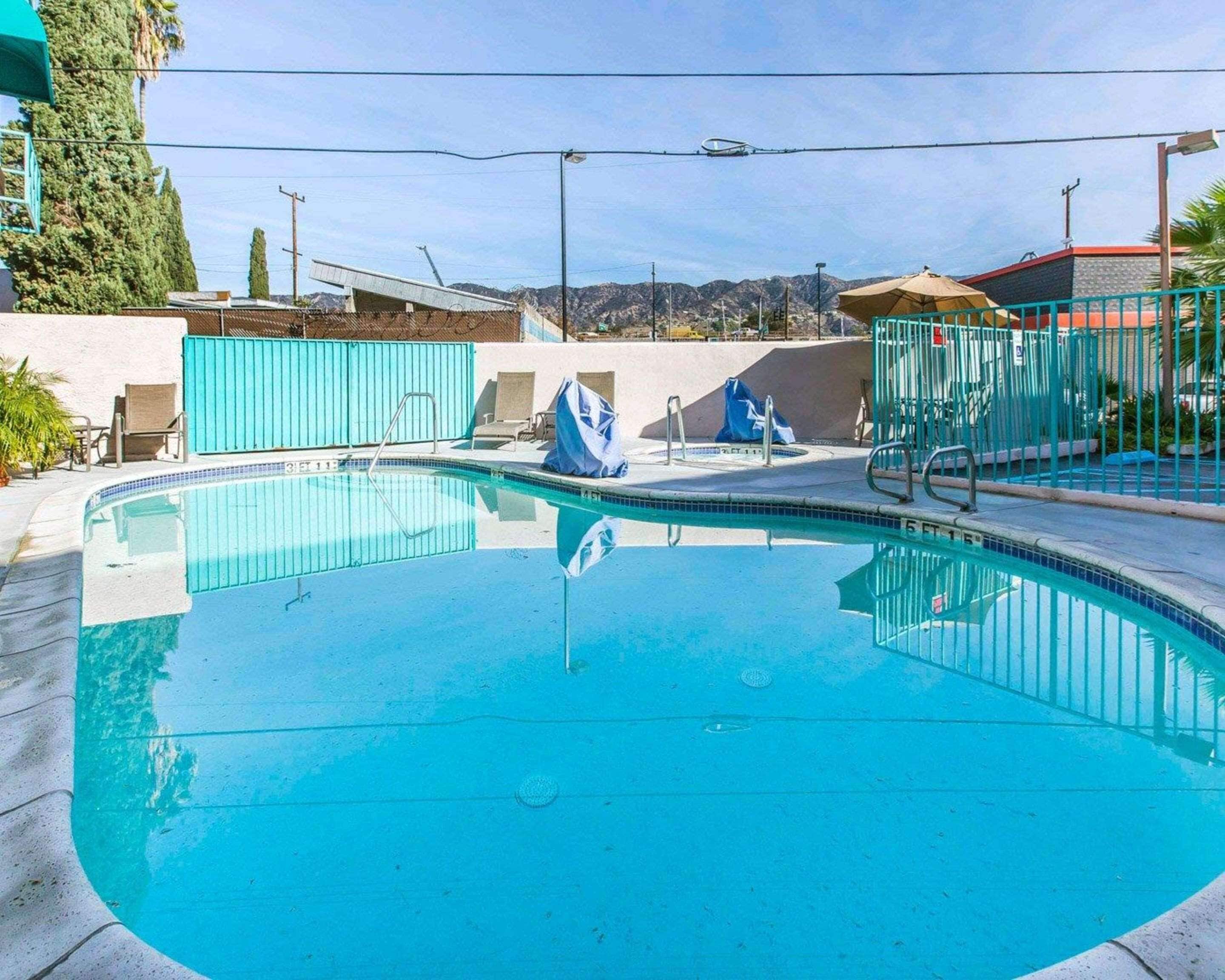 outdoor pool, open 9:00 am to 9:00 pm, pool umbrellas, pool loungers