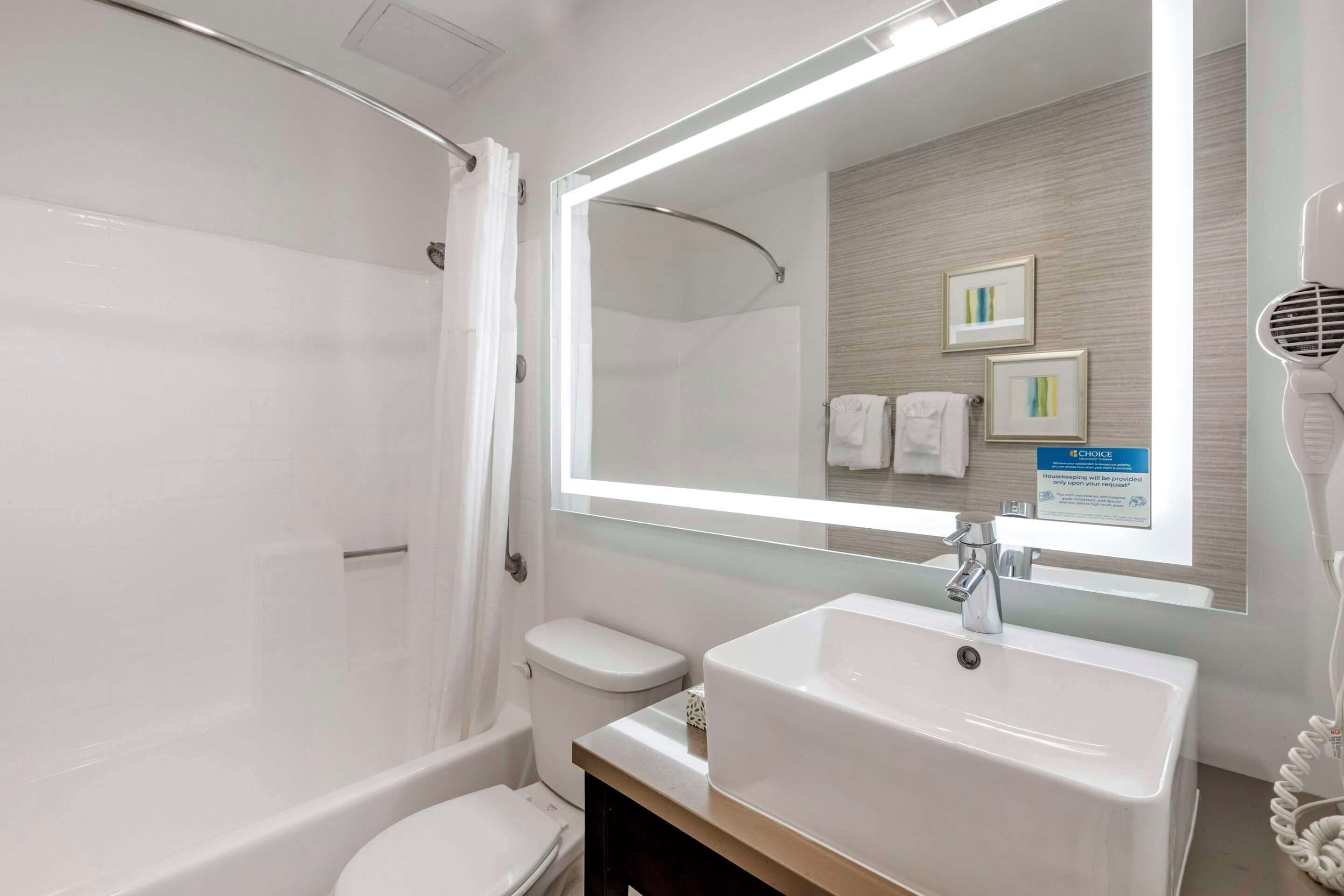 pillow-top beds, desk, laptop workspace, blackout curtains