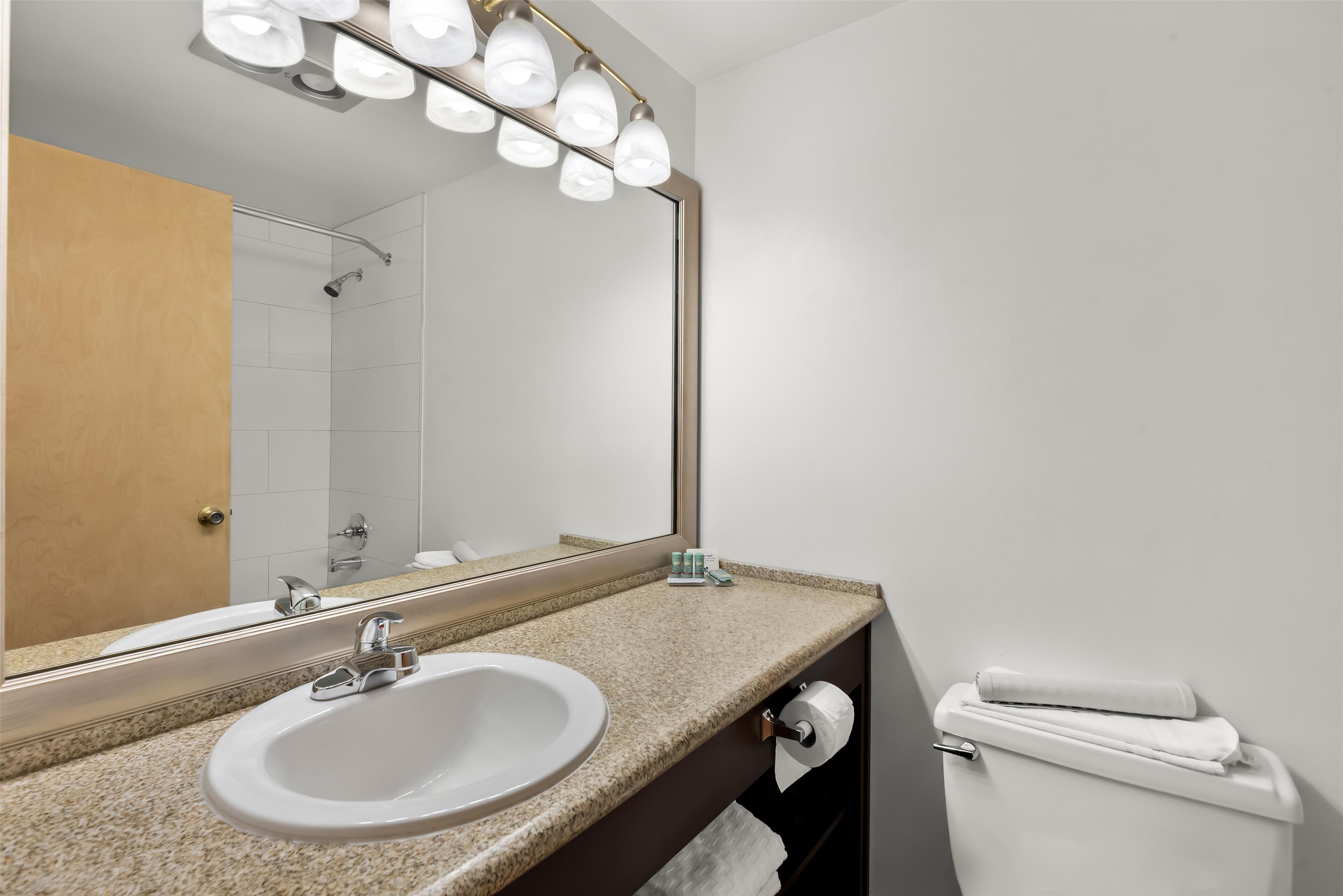 standard room, 1 king bed, non smoking, kitchenette (larger room;with sofabed) | bathroom | combined shower/bathtub, free toiletries, hair dryer, towels