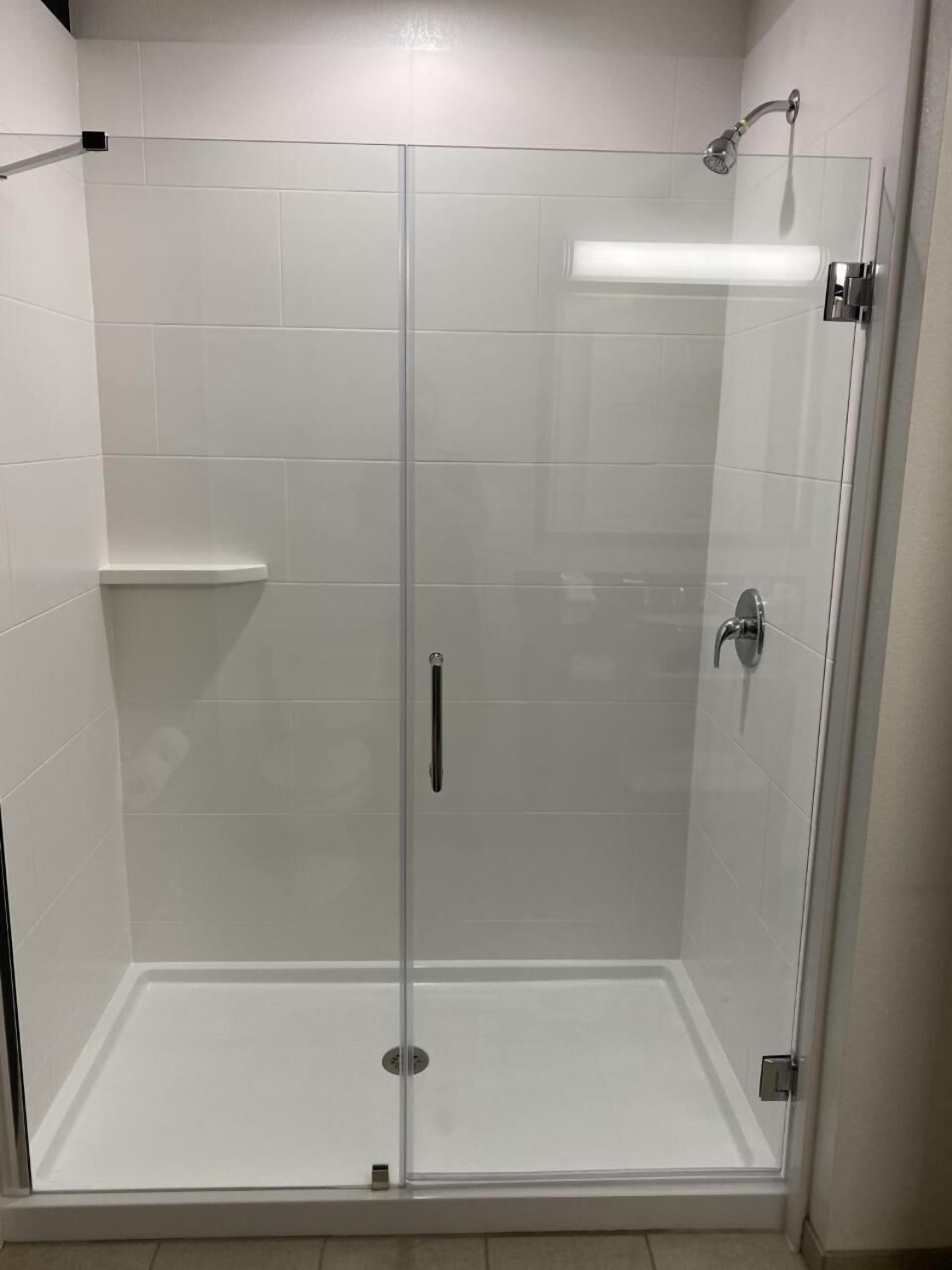 shower, designer toiletries, hair dryer, towels