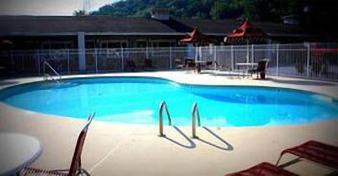 Seasonal outdoor pool, open 9 AM to 9:00 PM, pool umbrellas