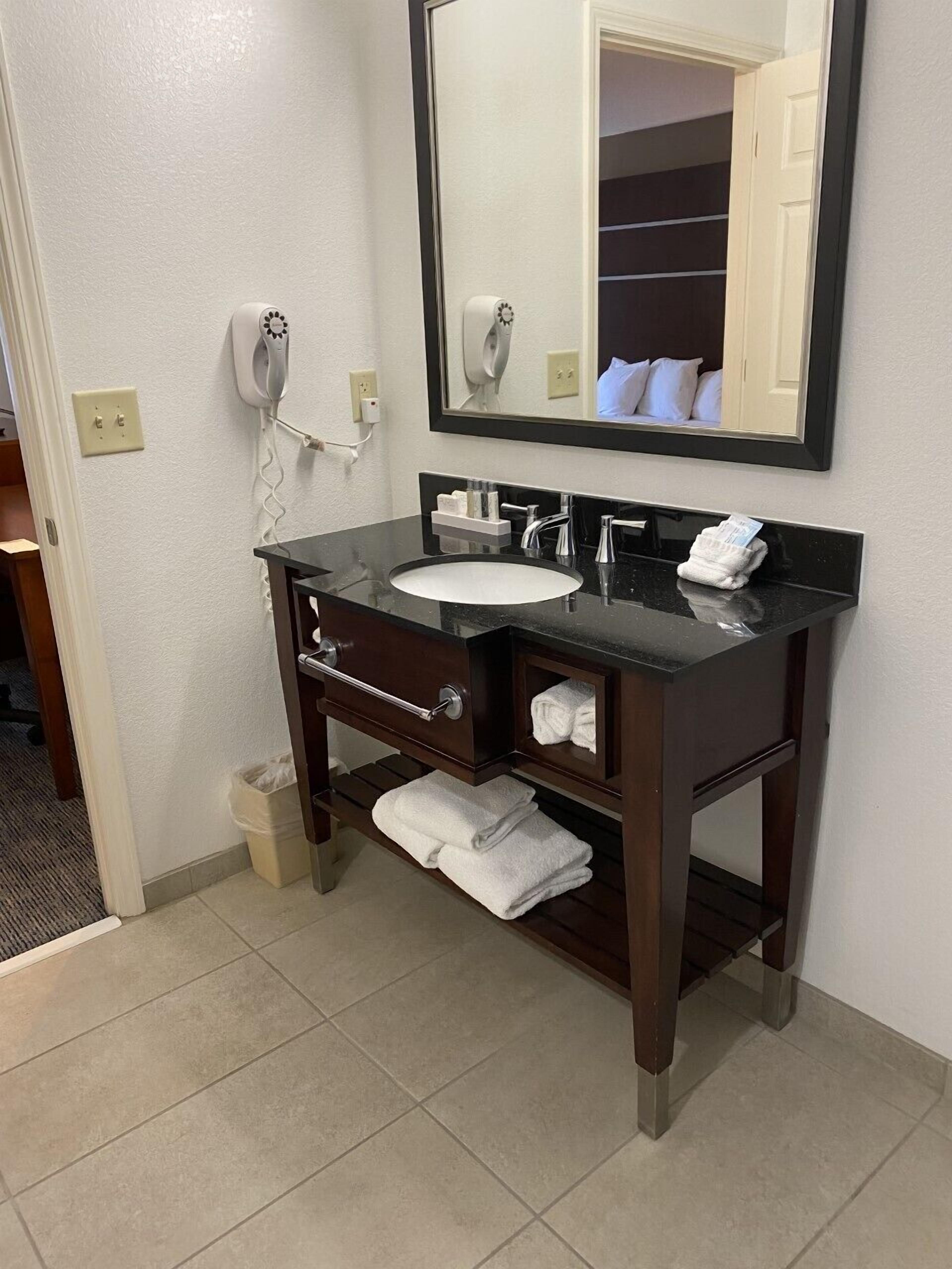 premier room, 1 king bed | bathroom | shower, designer toiletries, hair dryer, towels