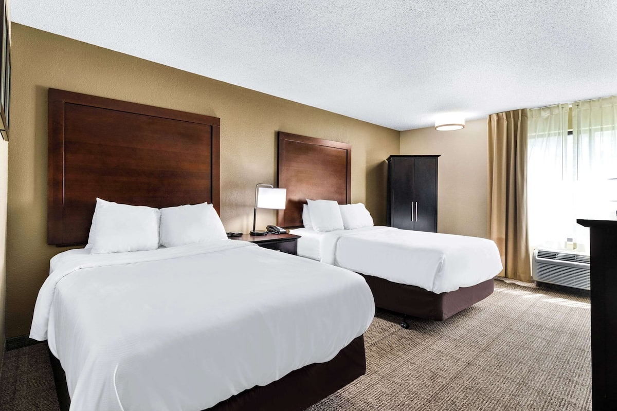 Premium bedding, desk, laptop workspace, iron/ironing board