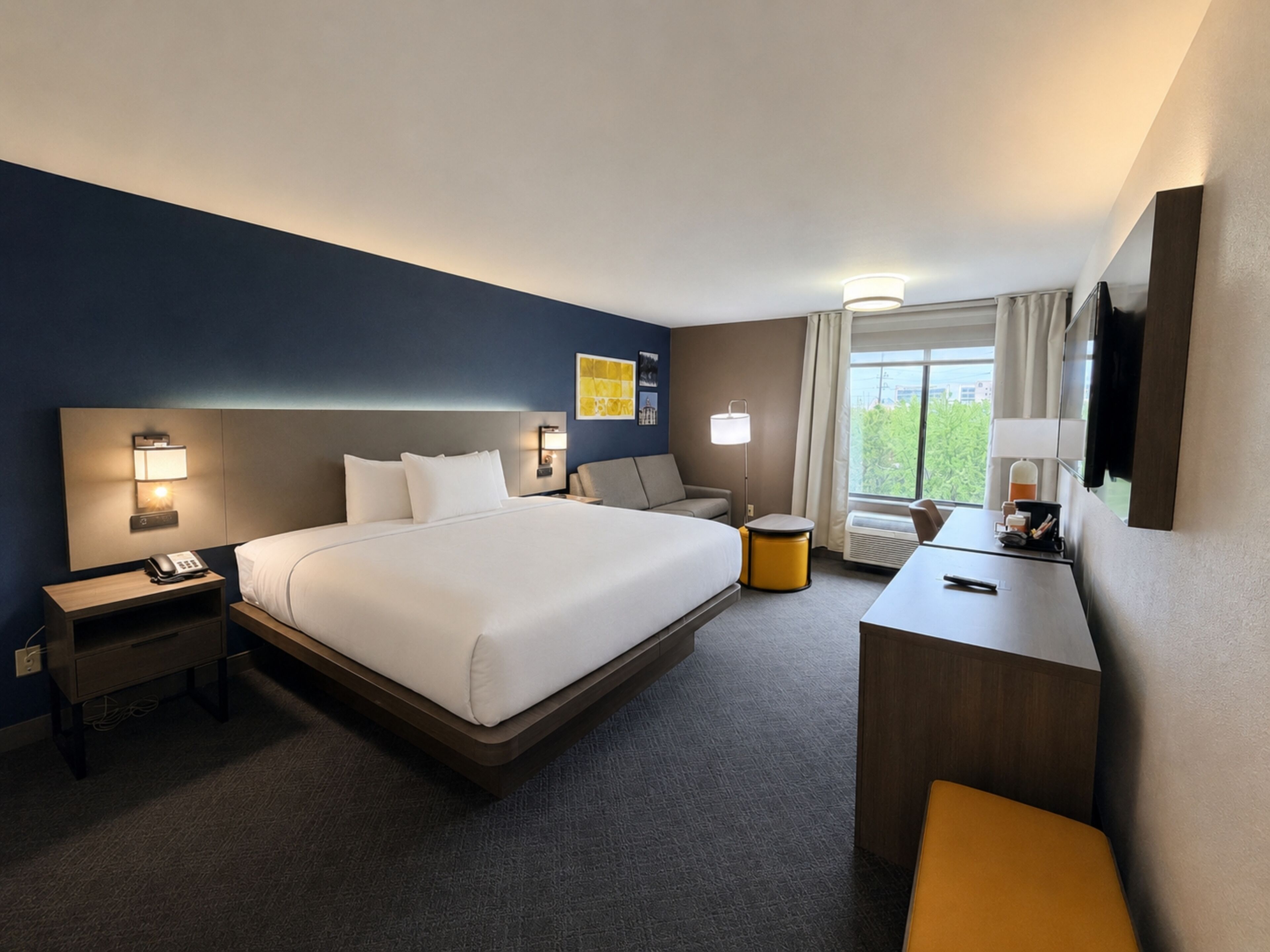 Premium bedding, desk, laptop workspace, iron/ironing board