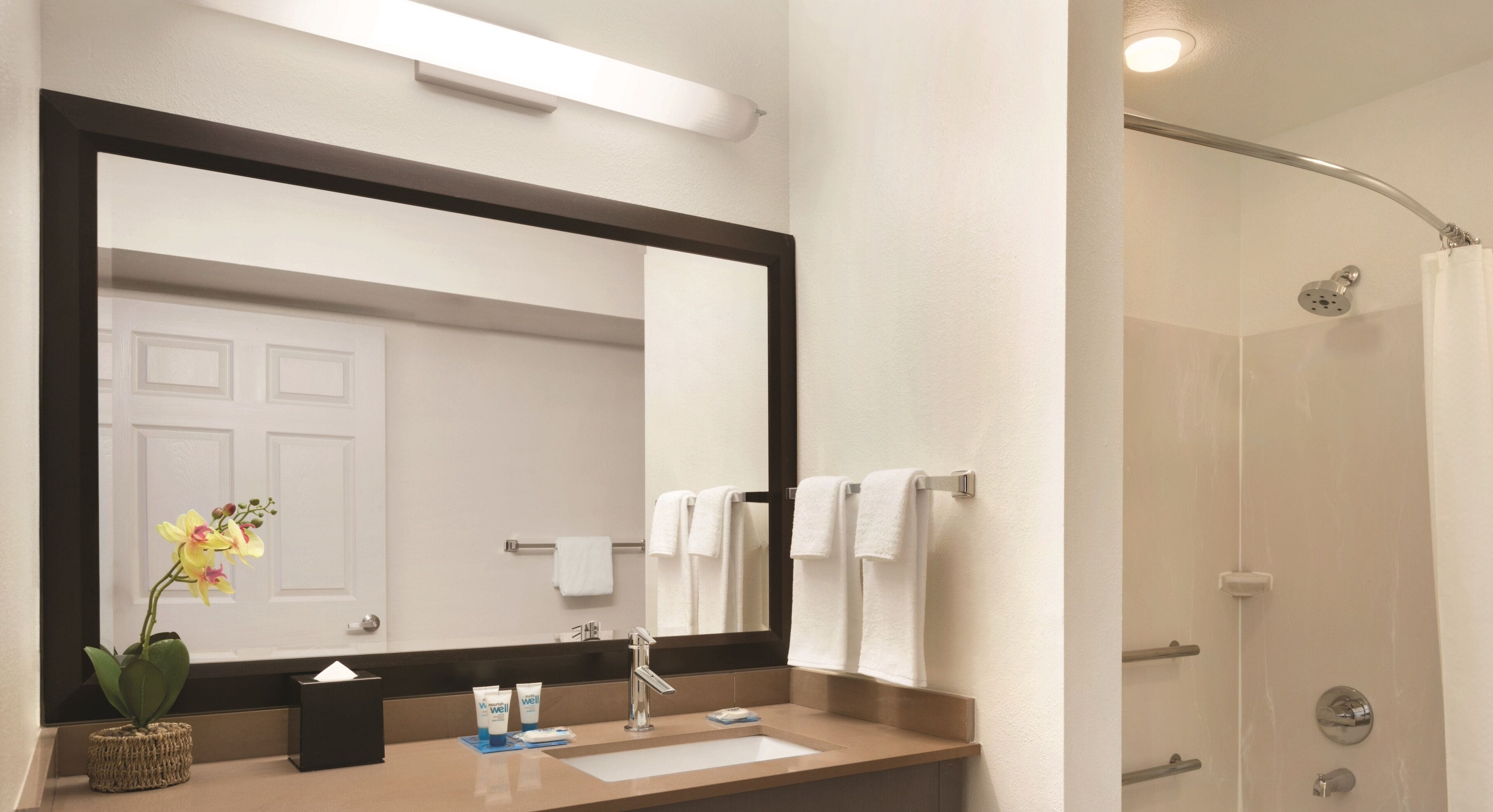 combined shower/bathtub, deep-soaking bathtub, designer toiletries