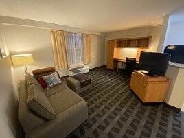 Suite, 1 Queen Bedroom, Non Smoking | Living area | 32-inch flat-screen TV with cable channels, TV, pay movies