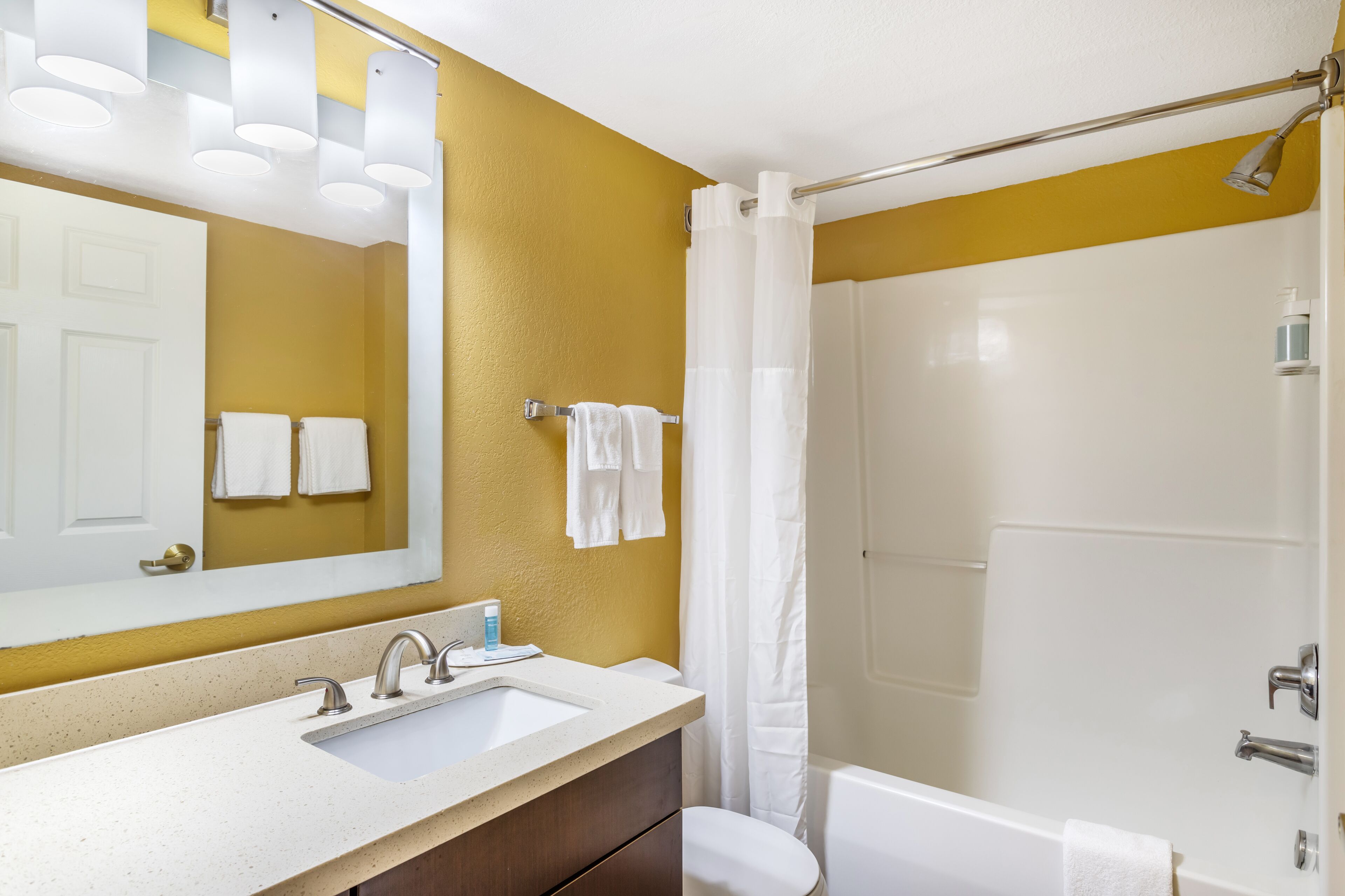 suite, 1 queen bed, non smoking | bathroom | combined shower/bathtub, deep-soaking bathtub, designer toiletries