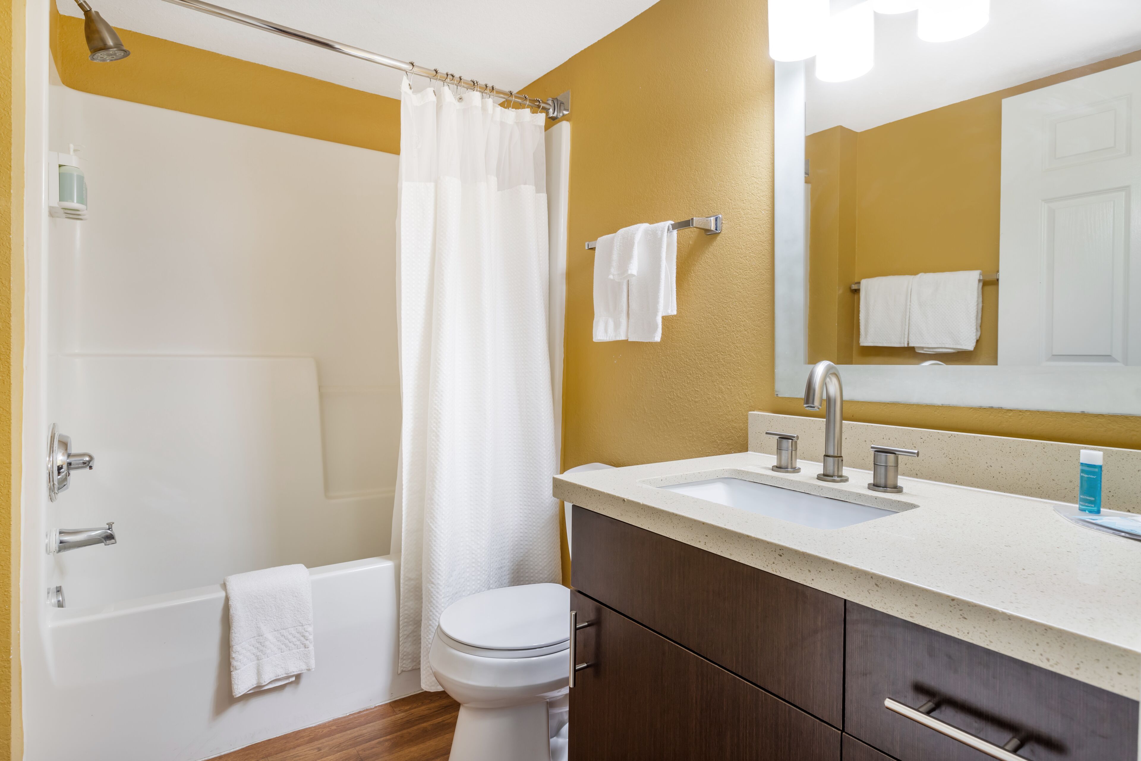 combined shower/bathtub, deep-soaking bathtub, designer toiletries