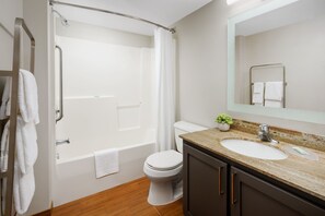 A modern bathroom with a bathtub, toilet, and sink. - Towneplace Suites by Marriott Horsham (Horsham)