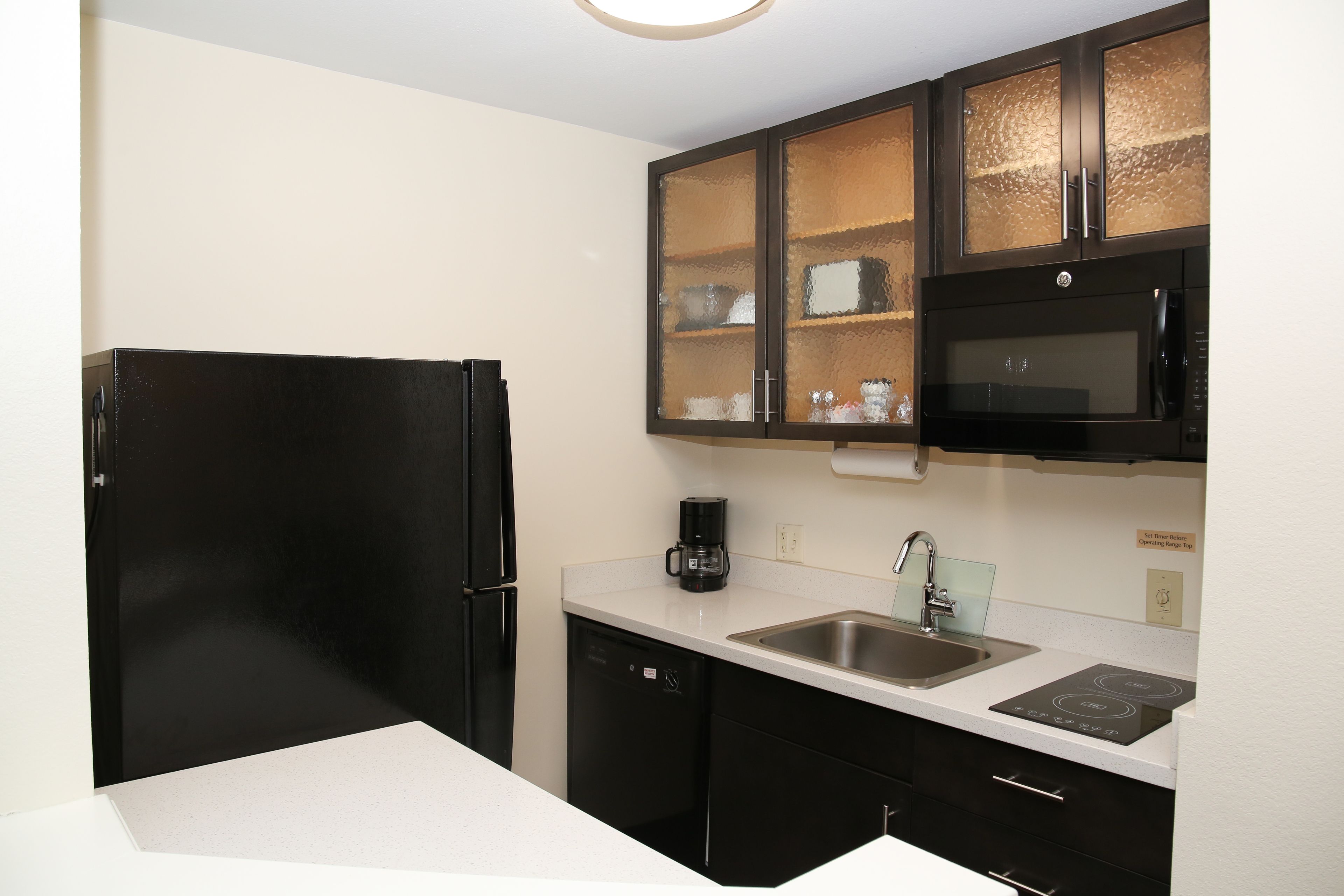 full-sized fridge, microwave, stovetop, dishwasher