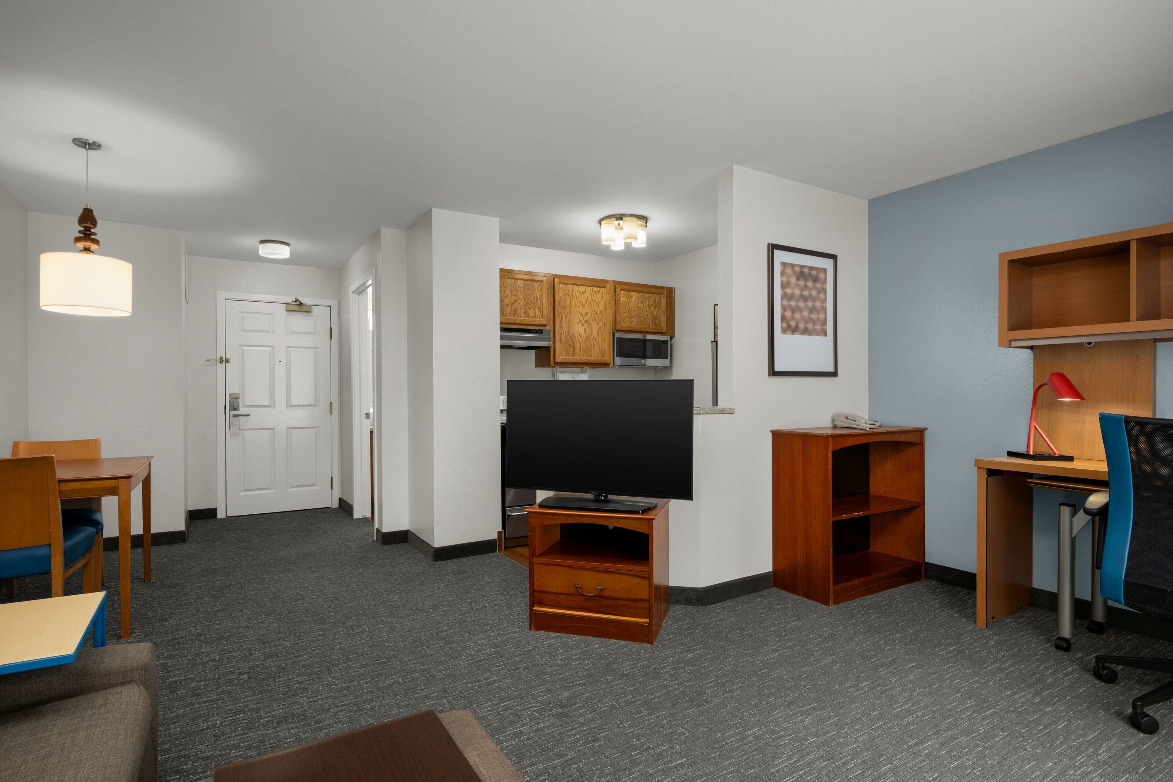 hypo-allergenic bedding, desk, laptop workspace, blackout curtains