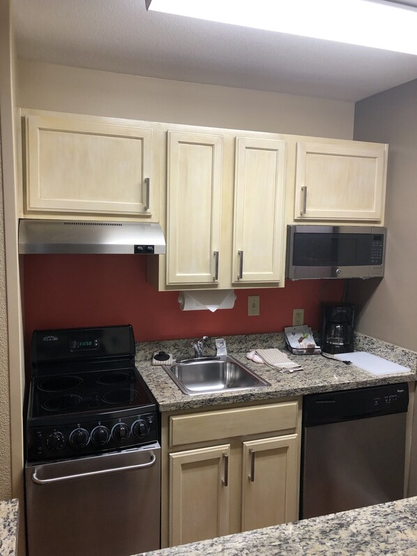 Full-sized fridge, microwave, stovetop, dishwasher
