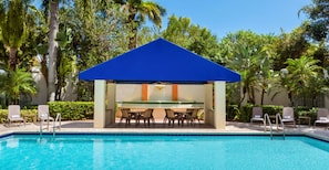 Outdoor pool, open 7:00 AM to 11:00 PM, pool umbrellas, pool loungers