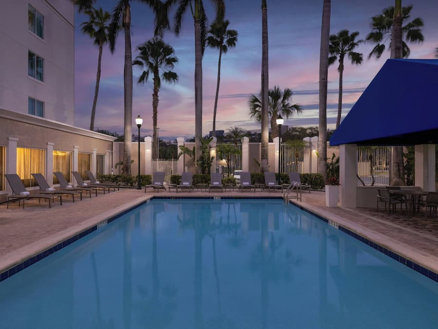 Outdoor pool, open 7:00 AM to 11:00 PM, pool umbrellas, sun loungers